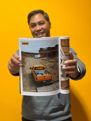 Golf sponsors get included in the homebuilder magazine. Shown: Ruck COO Shaun Merritt proudly shows his ad.